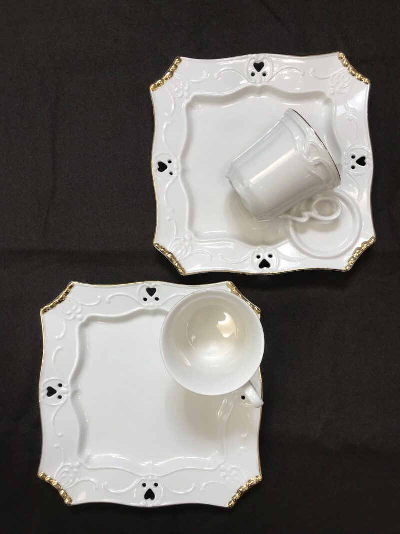Deux ensembles soucoupes de dejeuner Porcelaine Chriss G. collection