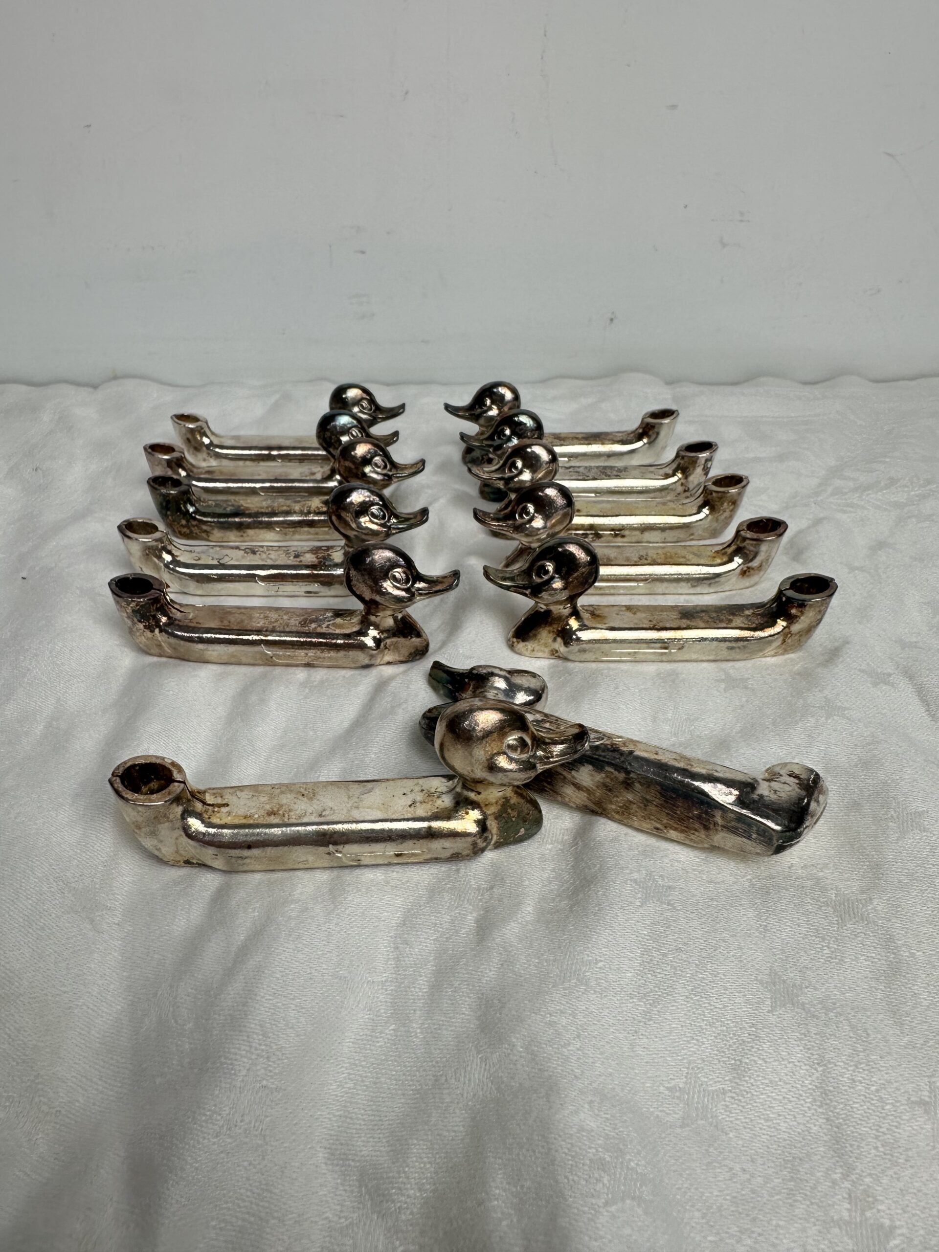 12 porte-couteaux canard en métal argenté